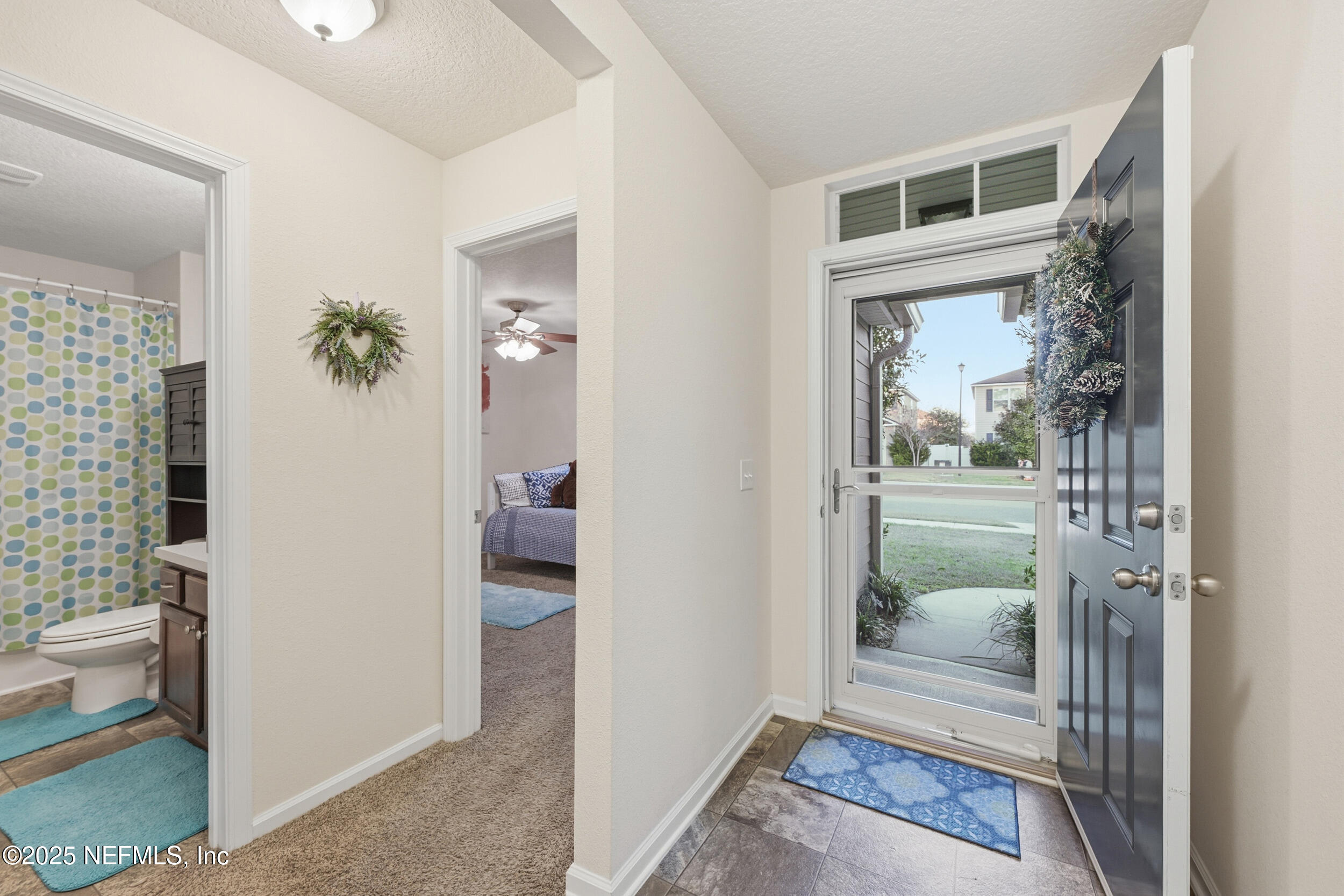 4068 Great Falls Loop Middleburg, FL 32068 - Photo 5 of 36 a view of a hallway with a livingroom and a livingroom with furniture