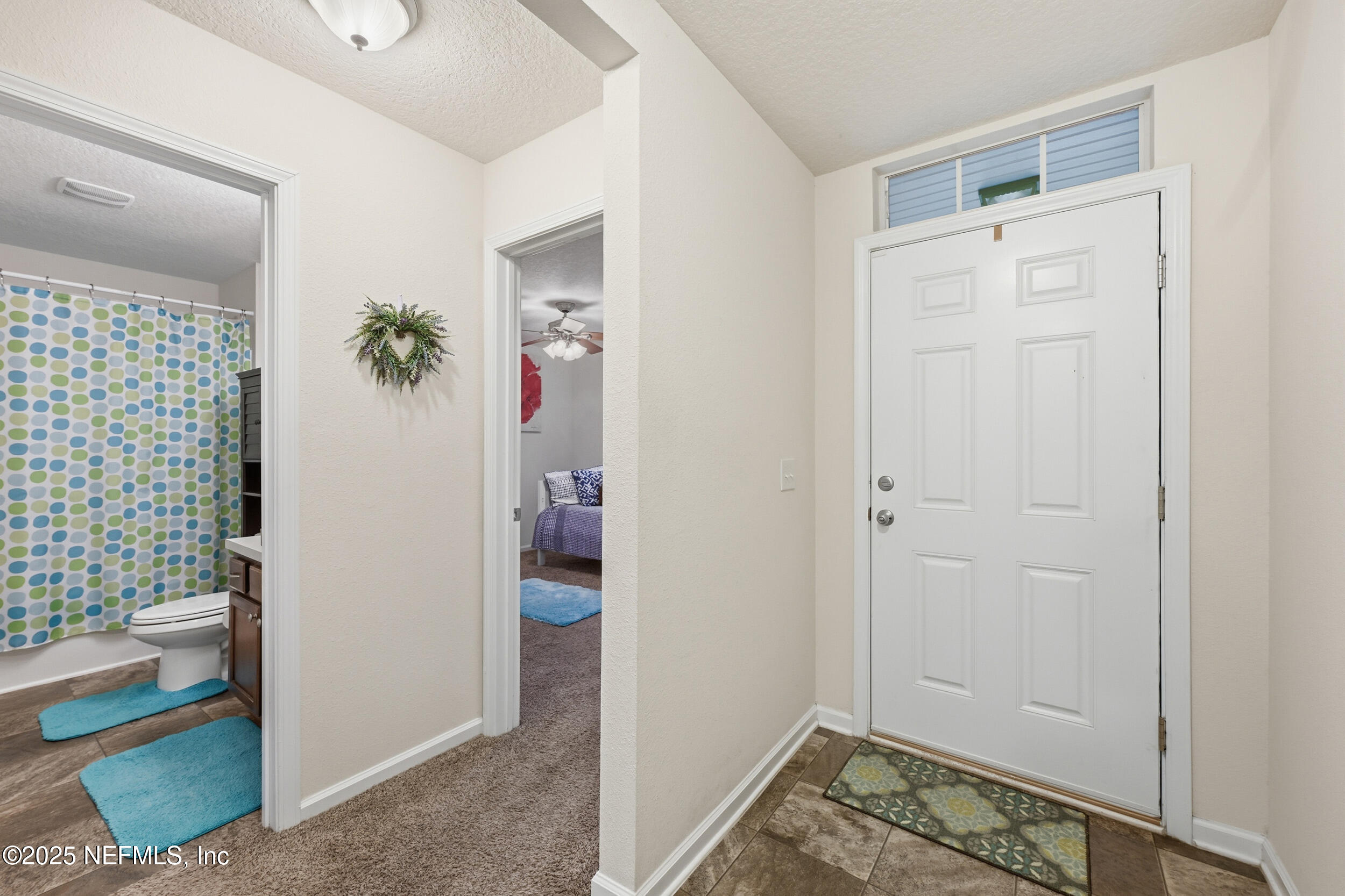 4068 Great Falls Loop Middleburg, FL 32068 - Photo 6 of 36 a view of an entryway with wooden floor