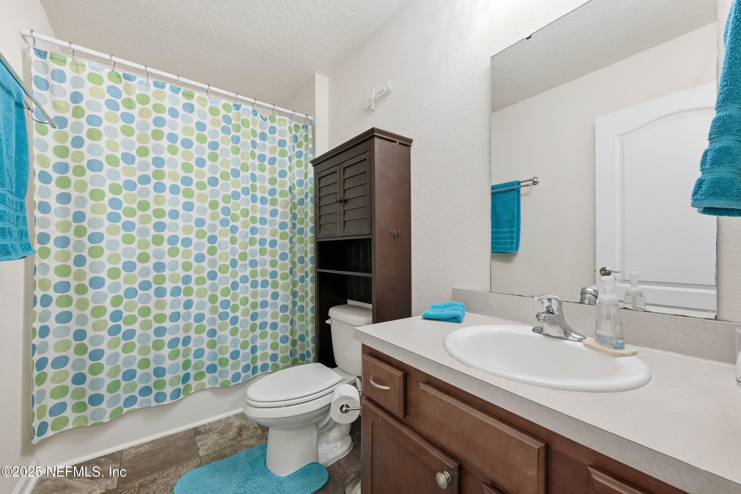 4068 Great Falls Loop Middleburg, FL 32068 - Photo 8 of 36 a bathroom with a sink toilet and shower