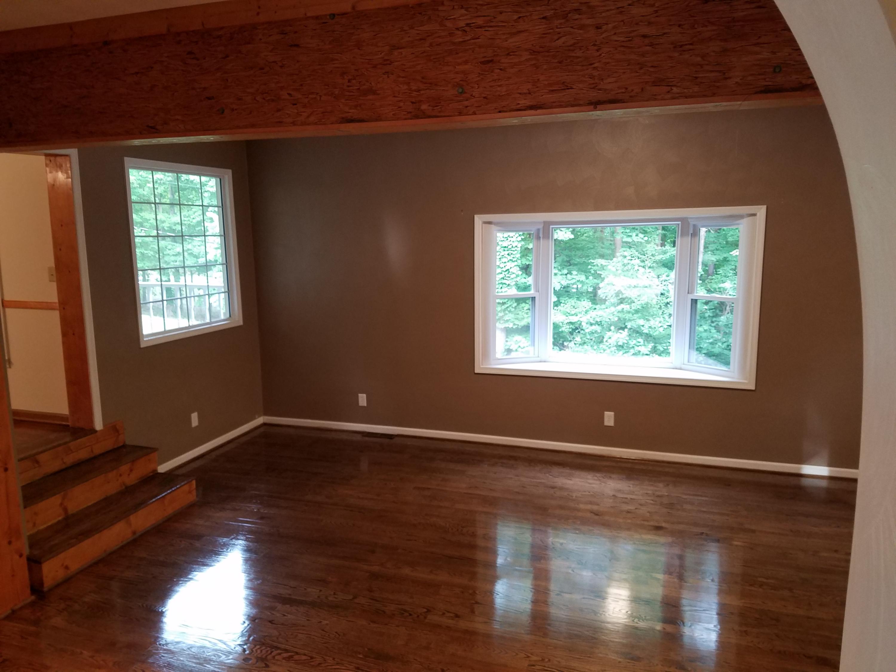 32 Charlie Road Hardy, VA 24101 - Photo 11 of 23 an empty room with wooden floor and windows