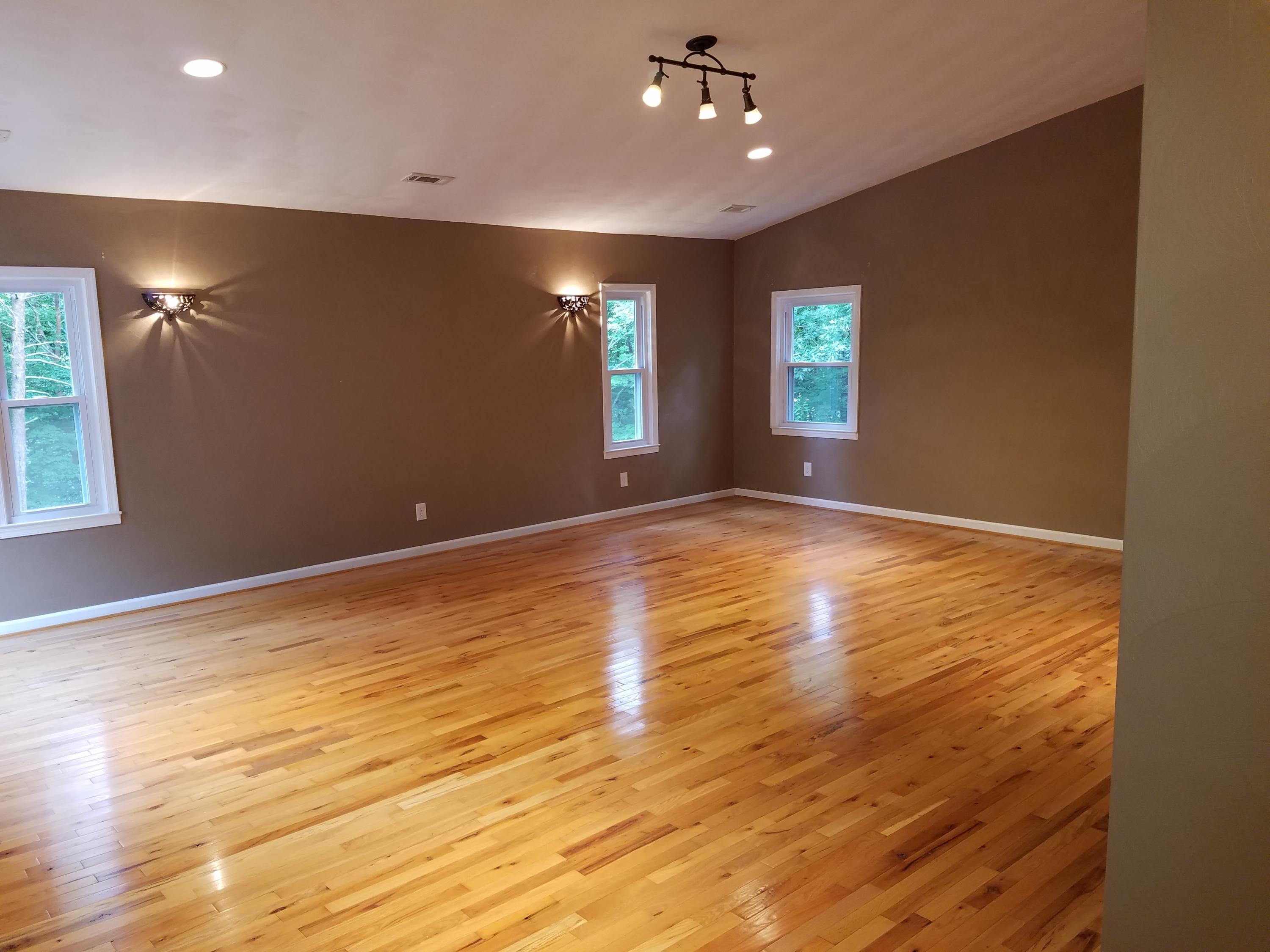 32 Charlie Road Hardy, VA 24101 - Photo 13 of 23 a view of an empty room with window and wooden floor