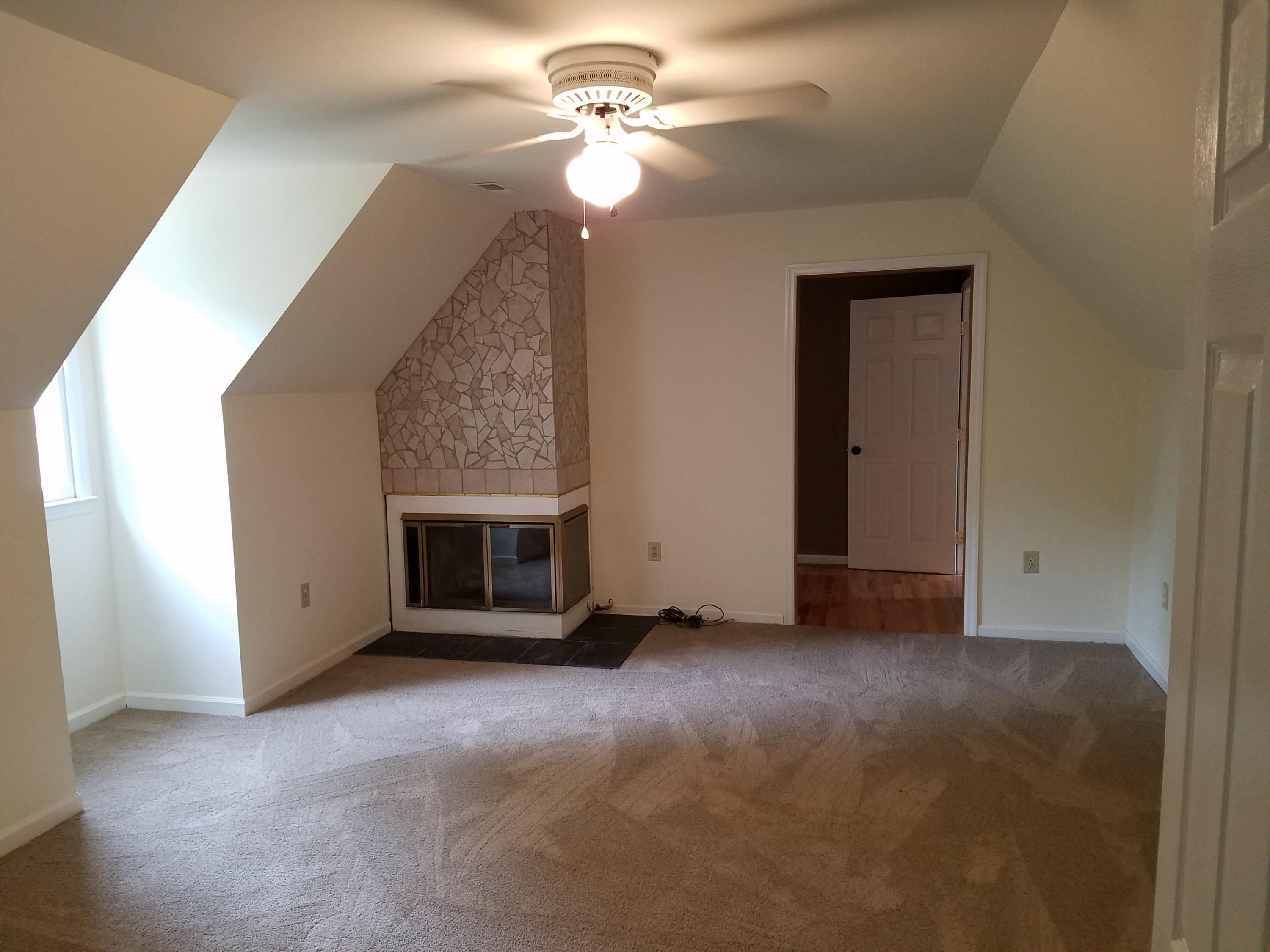 32 Charlie Road Hardy, VA 24101 - Photo 17 of 23 a view of a livingroom with a ceiling fan and chandelier fan
