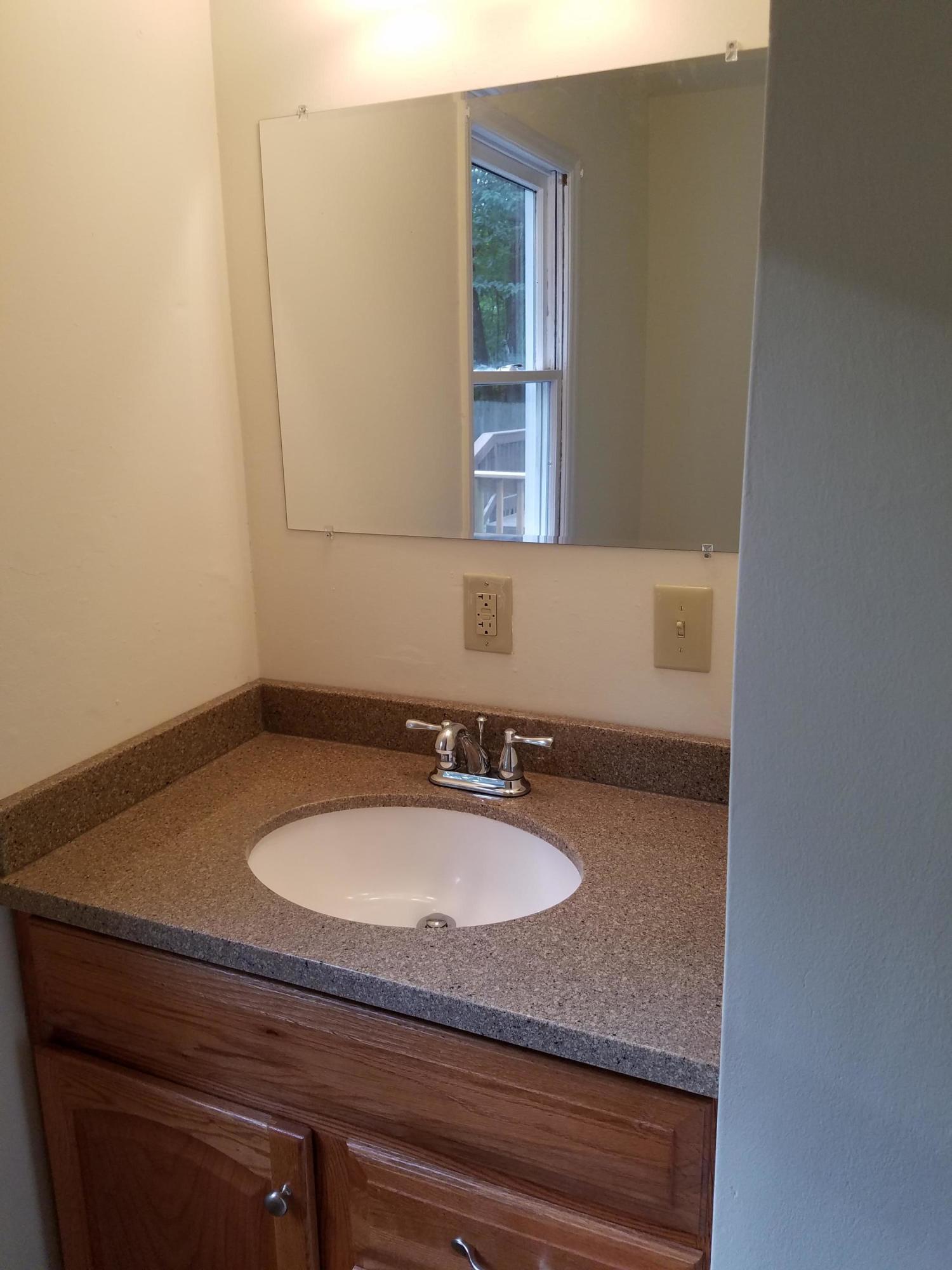 32 Charlie Road Hardy, VA 24101 - Photo 18 of 23 a bathroom with a granite countertop sink and a mirror