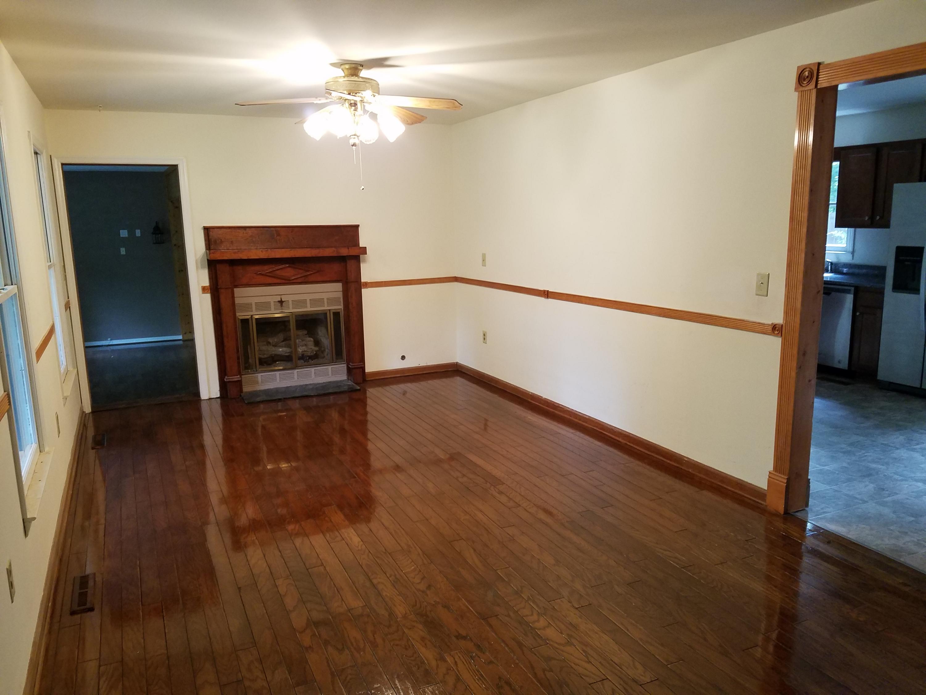 32 Charlie Road Hardy, VA 24101 - Photo 5 of 23 wooden floor in an empty room with a window