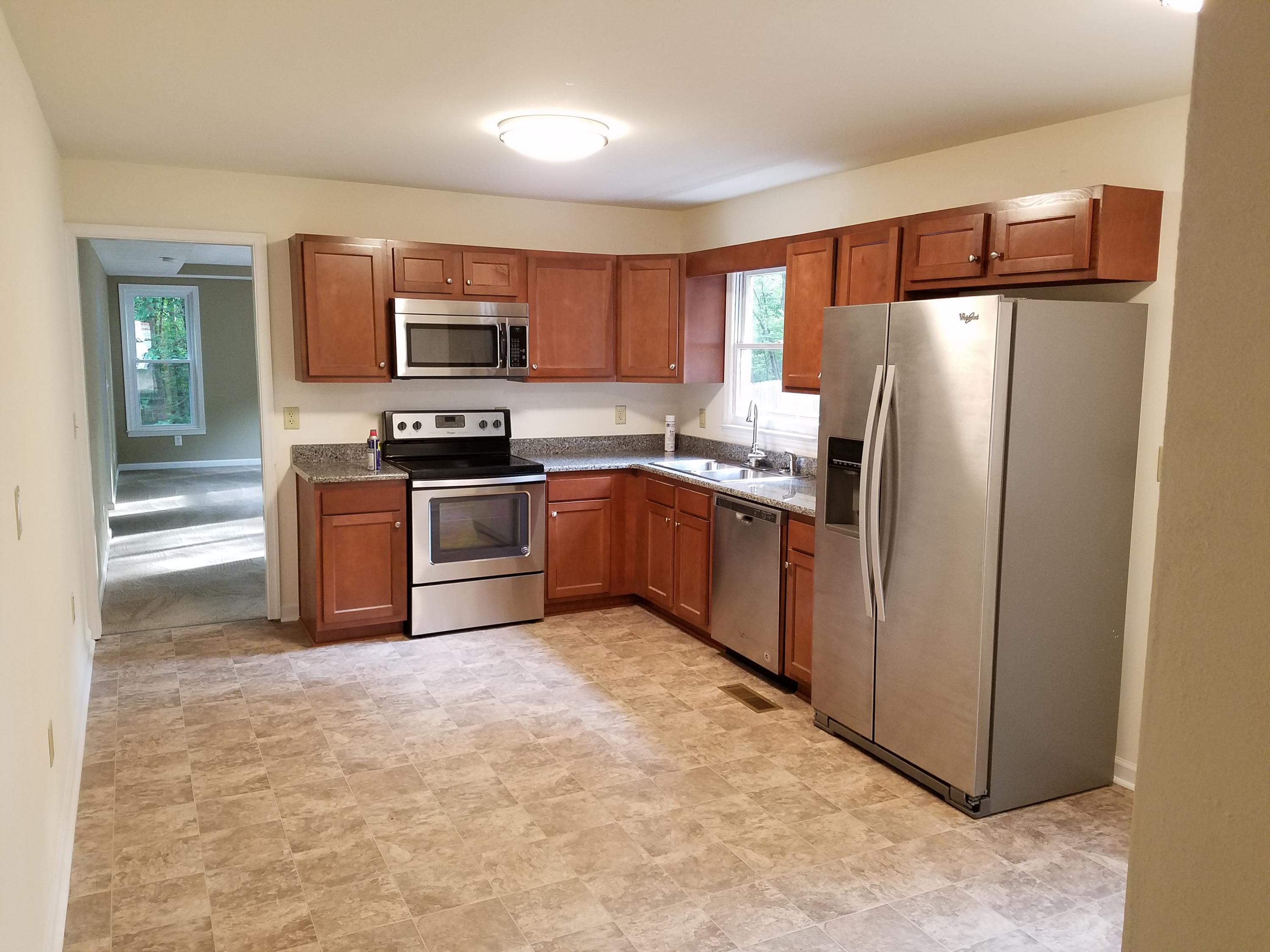 32 Charlie Road Hardy, VA 24101 - Photo 7 of 23 a kitchen with stainless steel appliances granite countertop a refrigerator stove and oven