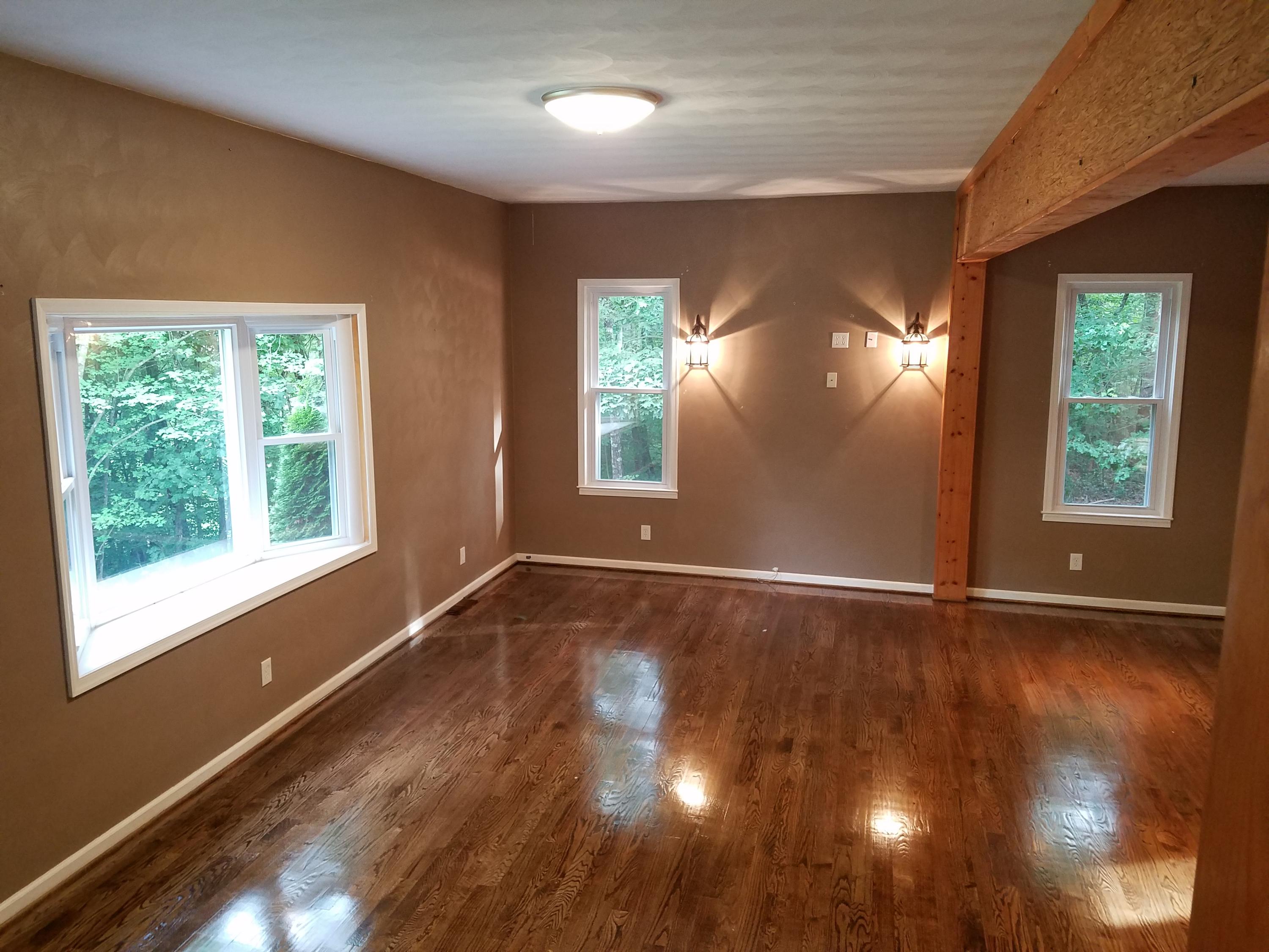 32 Charlie Road Hardy, VA 24101 - Photo 9 of 23 an empty room with wooden floor and windows