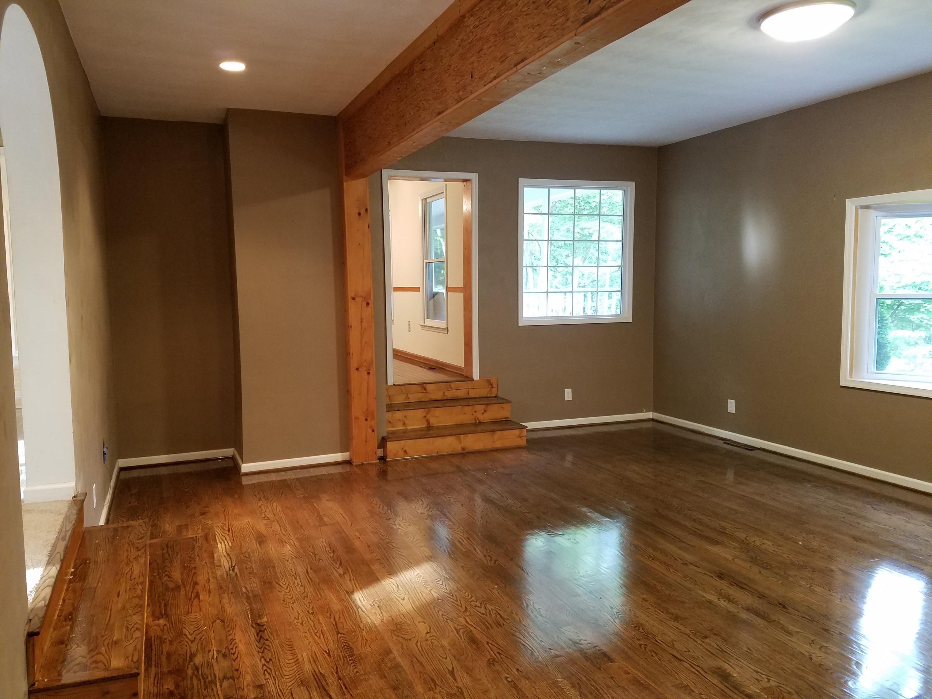 32 Charlie Road Hardy, VA 24101 - Photo 10 of 23 an empty room with wooden floor and windows