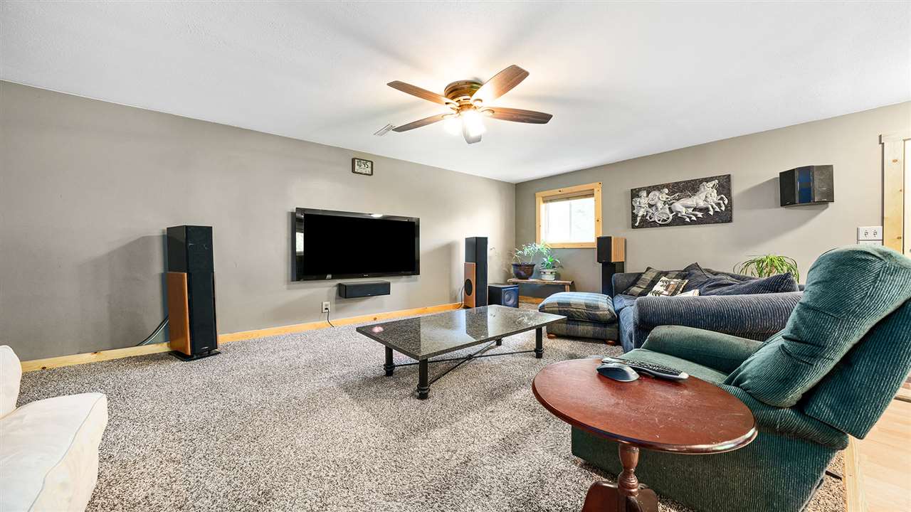 2436 South Ridge Road Oregon, IL 61061 - Photo 21 of 33 a living room with furniture and a flat screen tv
