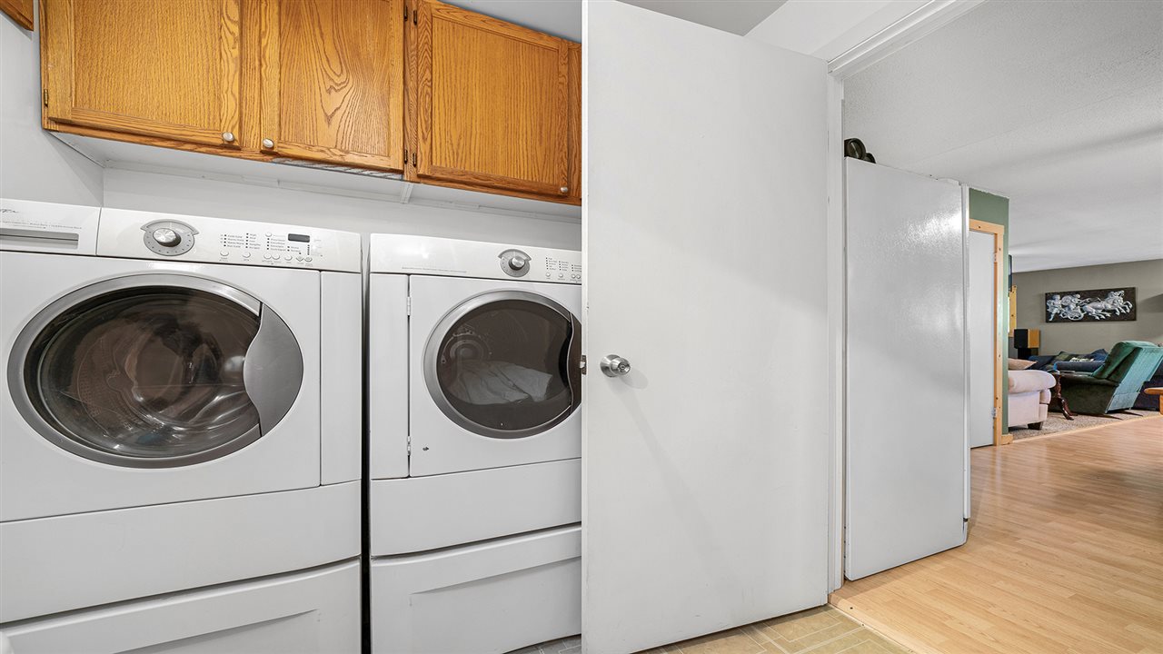 2436 South Ridge Road Oregon, IL 61061 - Photo 23 of 33 a utility room with dryer washer and a view of kitchen