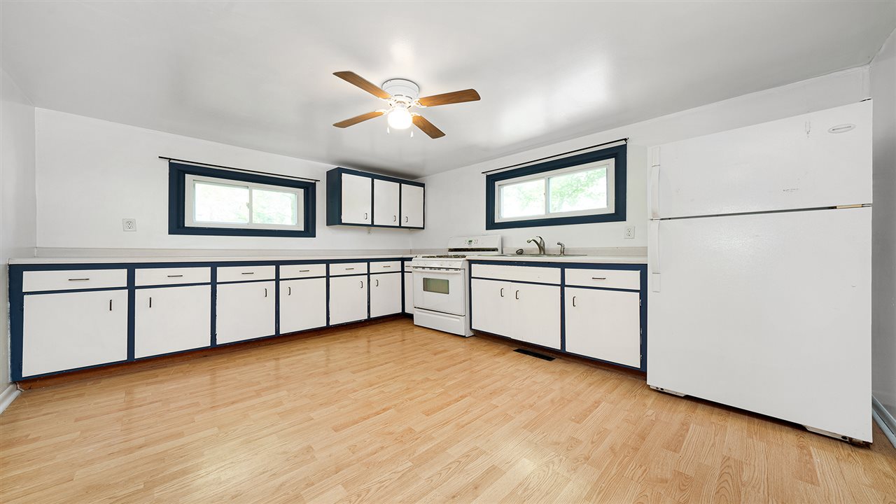 2436 South Ridge Road Oregon, IL 61061 - Photo 8 of 33 a kitchen with stainless steel appliances a white stove top oven sink and cabinets