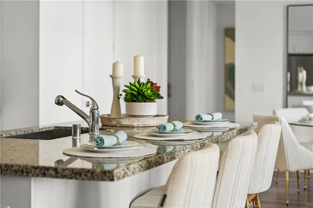 a dining room with furniture and wooden floor