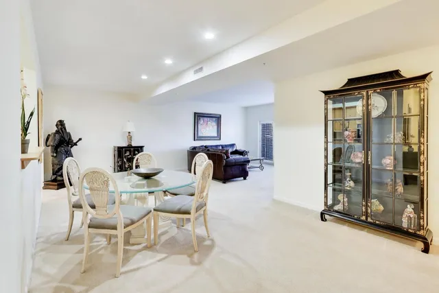 a view of a livingroom with furniture and a gym equipment