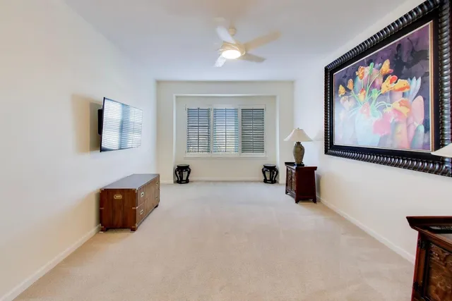 a bedroom with furniture and a flat screen tv