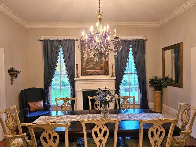 a view of a dining room with furniture window and outside view