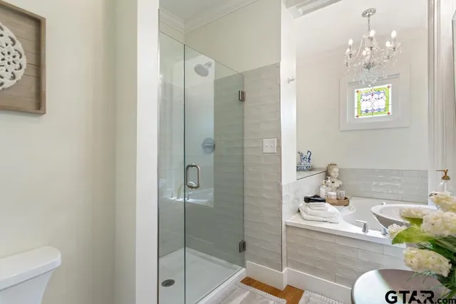 a view of a livingroom with furniture and hardwood floor