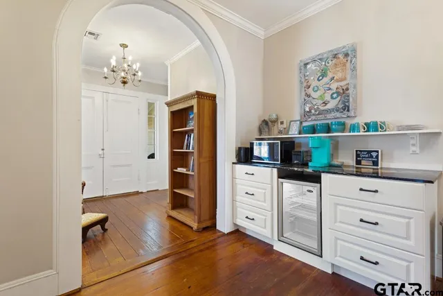 a view of living room with furniture and floor to ceiling window
