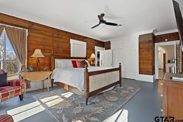 a bedroom with a bed and a fireplace