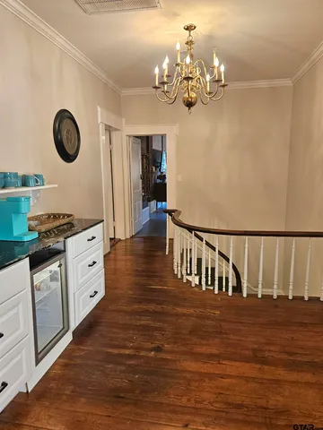 a view of kitchen with stove and cabinets