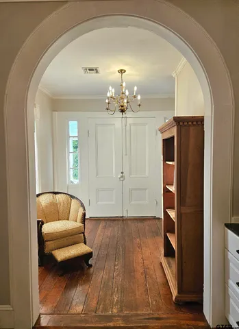 a spacious bedroom with a bed and a couch