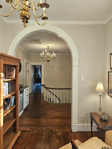a view of a livingroom with furniture and staircase