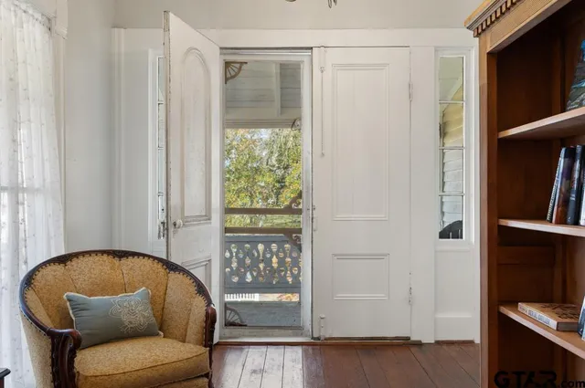 a very nice looking room with a large window and chandelier