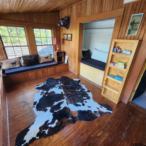 a room with wooden floor and furniture