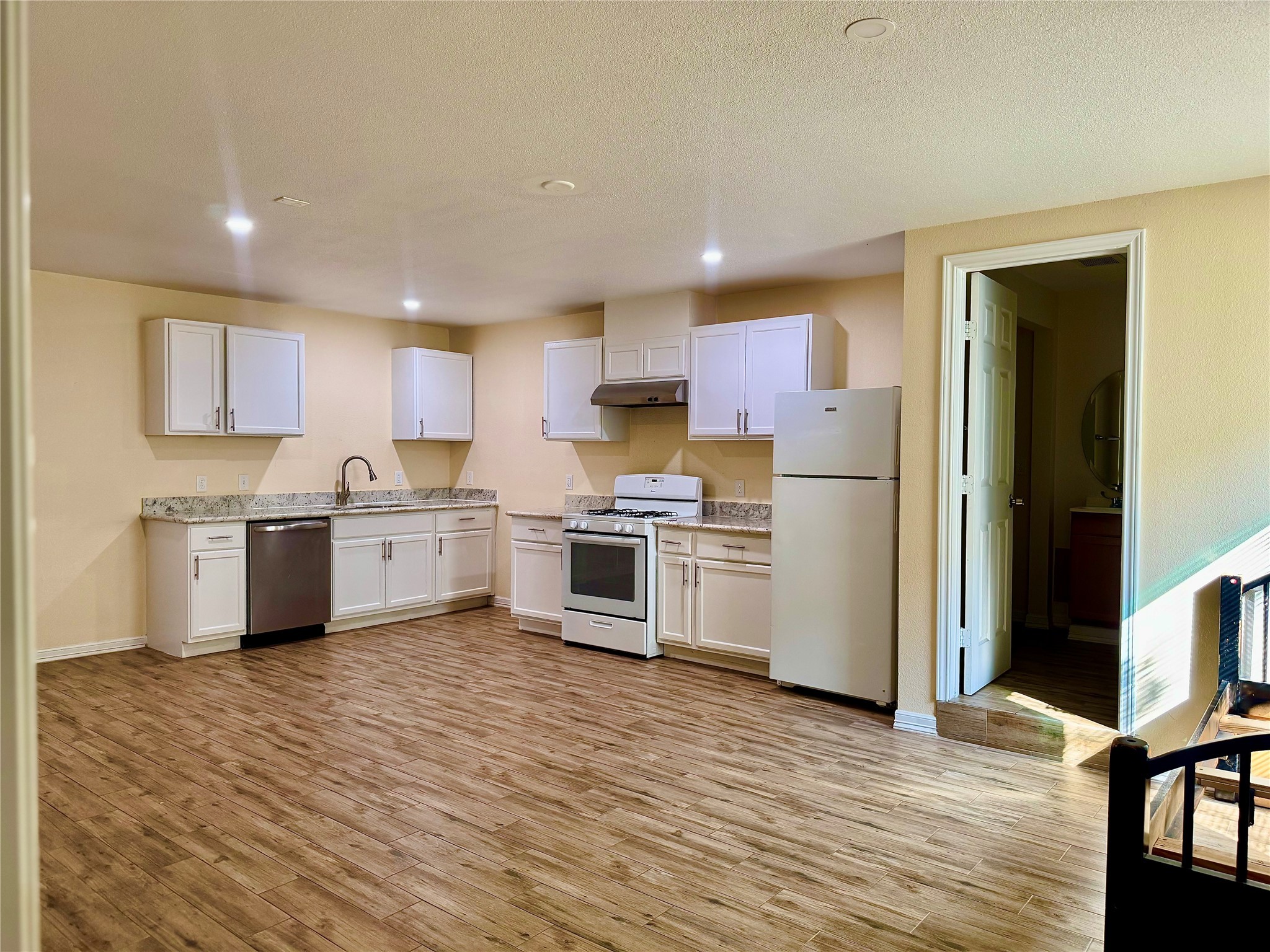 711 Hahlo Street, Unit STUDIO Houston, TX 77020 - Photo 1 of 10 a kitchen with stainless steel appliances a sink and a refrigerator