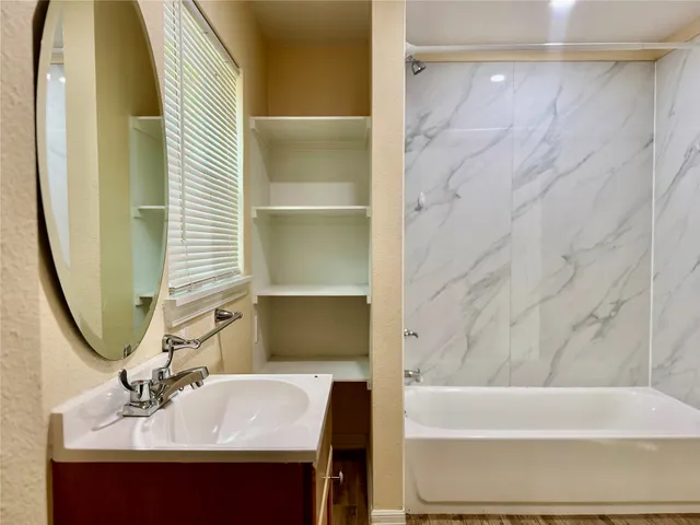 a bathroom with a sink and a mirror