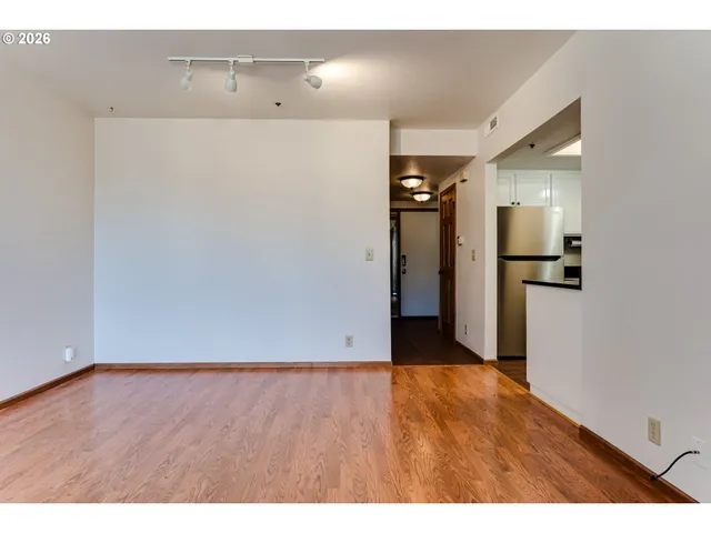 a view of hallway with wooden floor