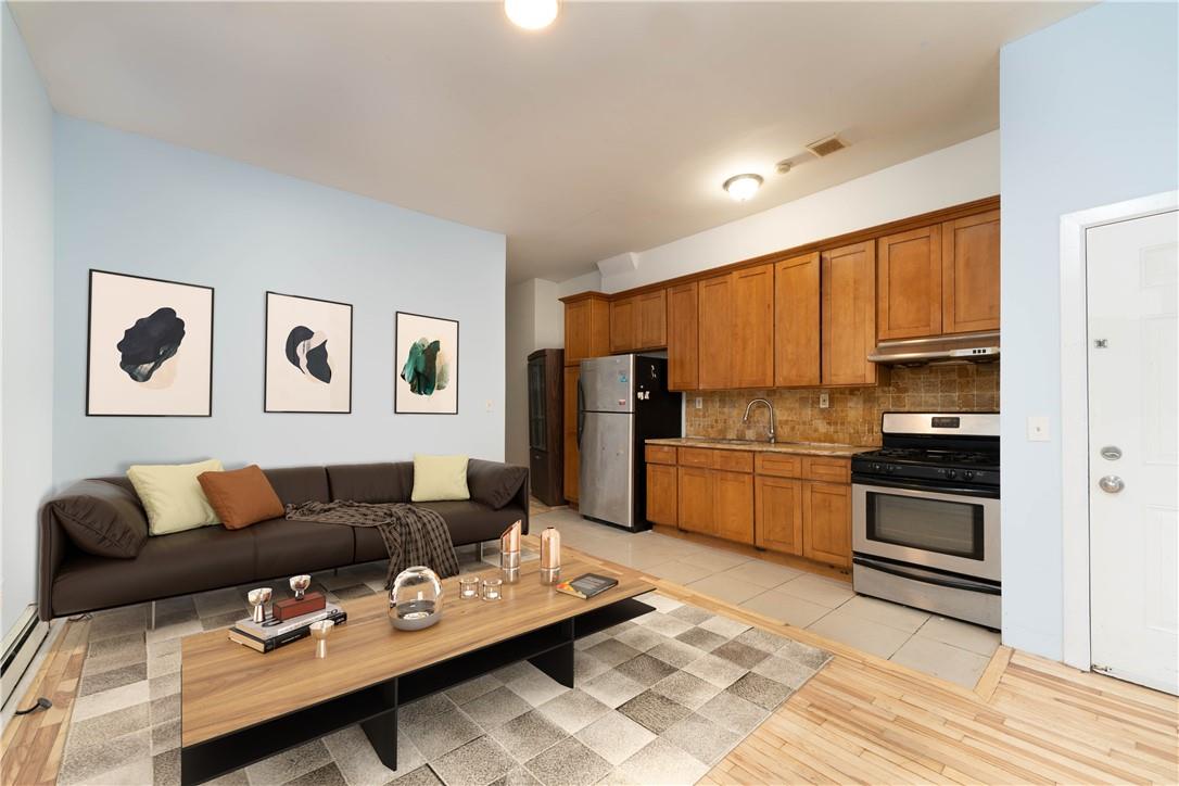 1st floor open kitchen/living room (virtually staged)