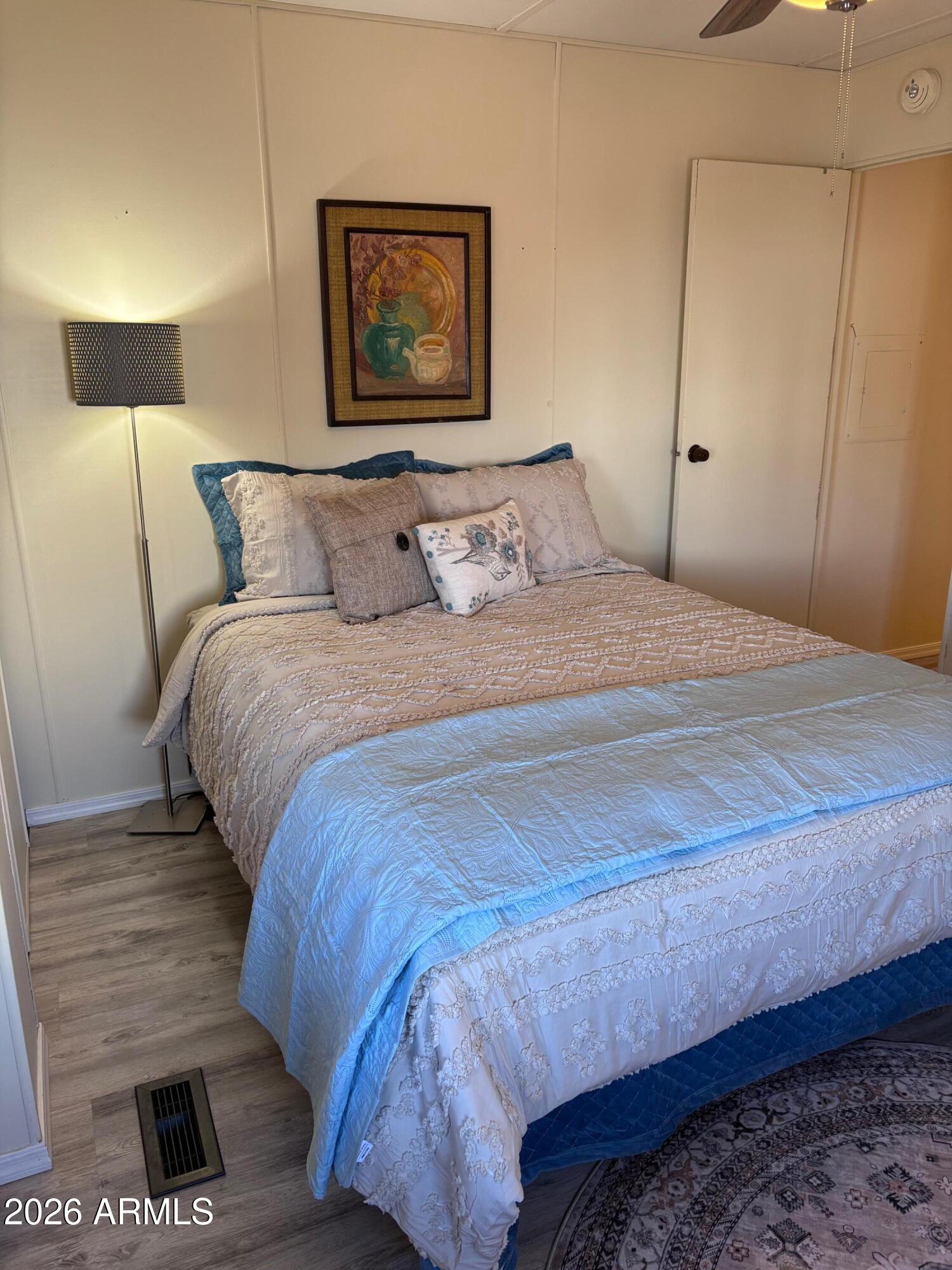 15802 South Gilbert Road, Unit 131 Chandler, AZ 85225 - Photo 12 of 30 a bedroom with a bed and a night stand