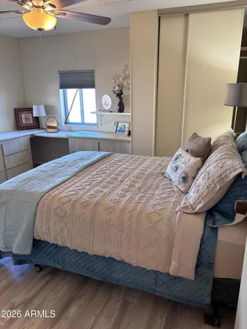 a bedroom with a bed and a dresser