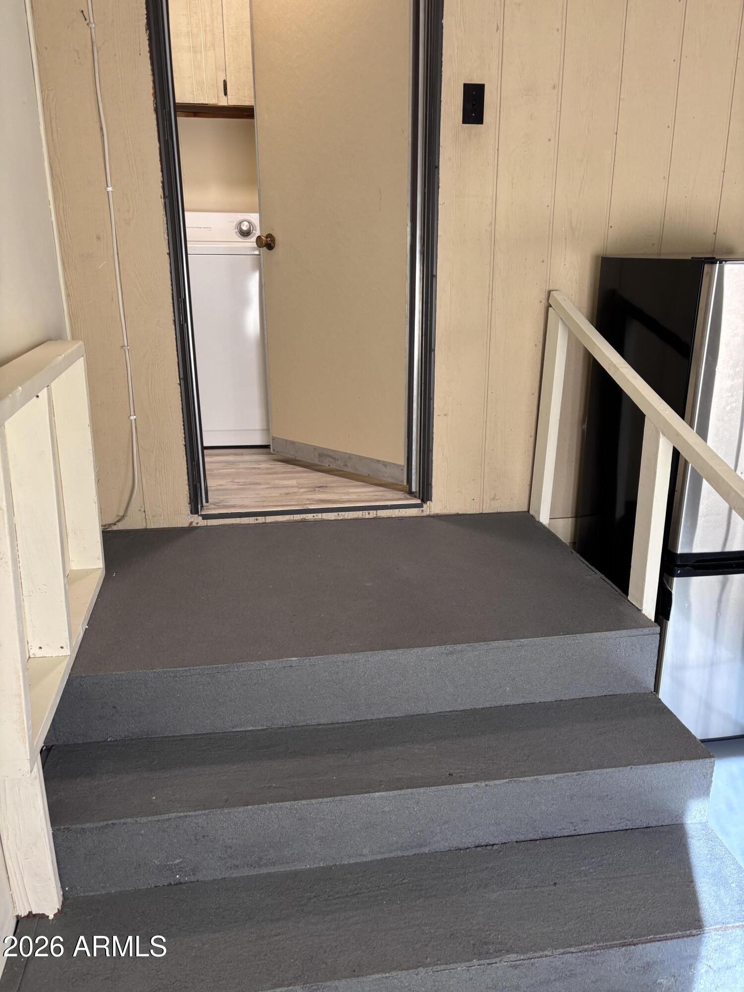 15802 South Gilbert Road, Unit 131 Chandler, AZ 85225 - Photo 15 of 30 a view of an empty room with wooden floor and a window