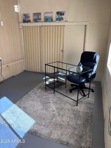 a workspace with furniture and a window