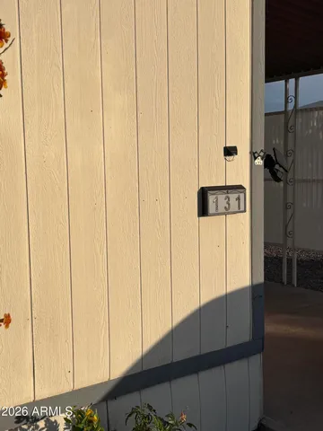 a view of a livingroom with wooden floor and furniture