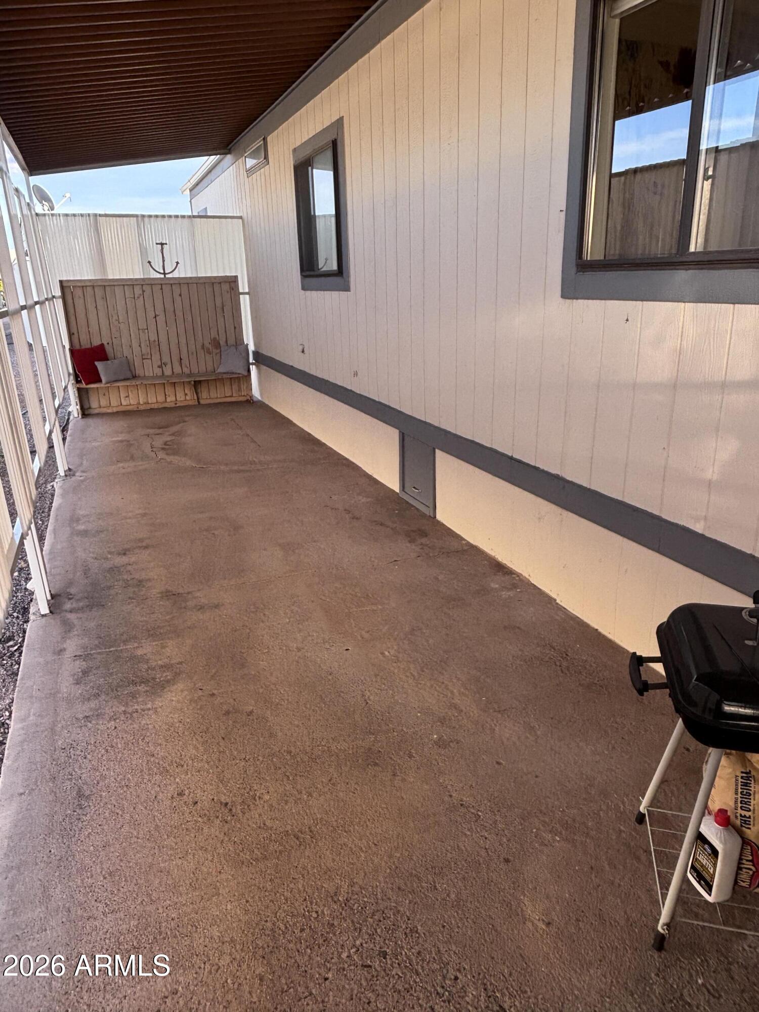 15802 South Gilbert Road, Unit 131 Chandler, AZ 85225 - Photo 26 of 30 a view of a livingroom with wooden floor and furniture