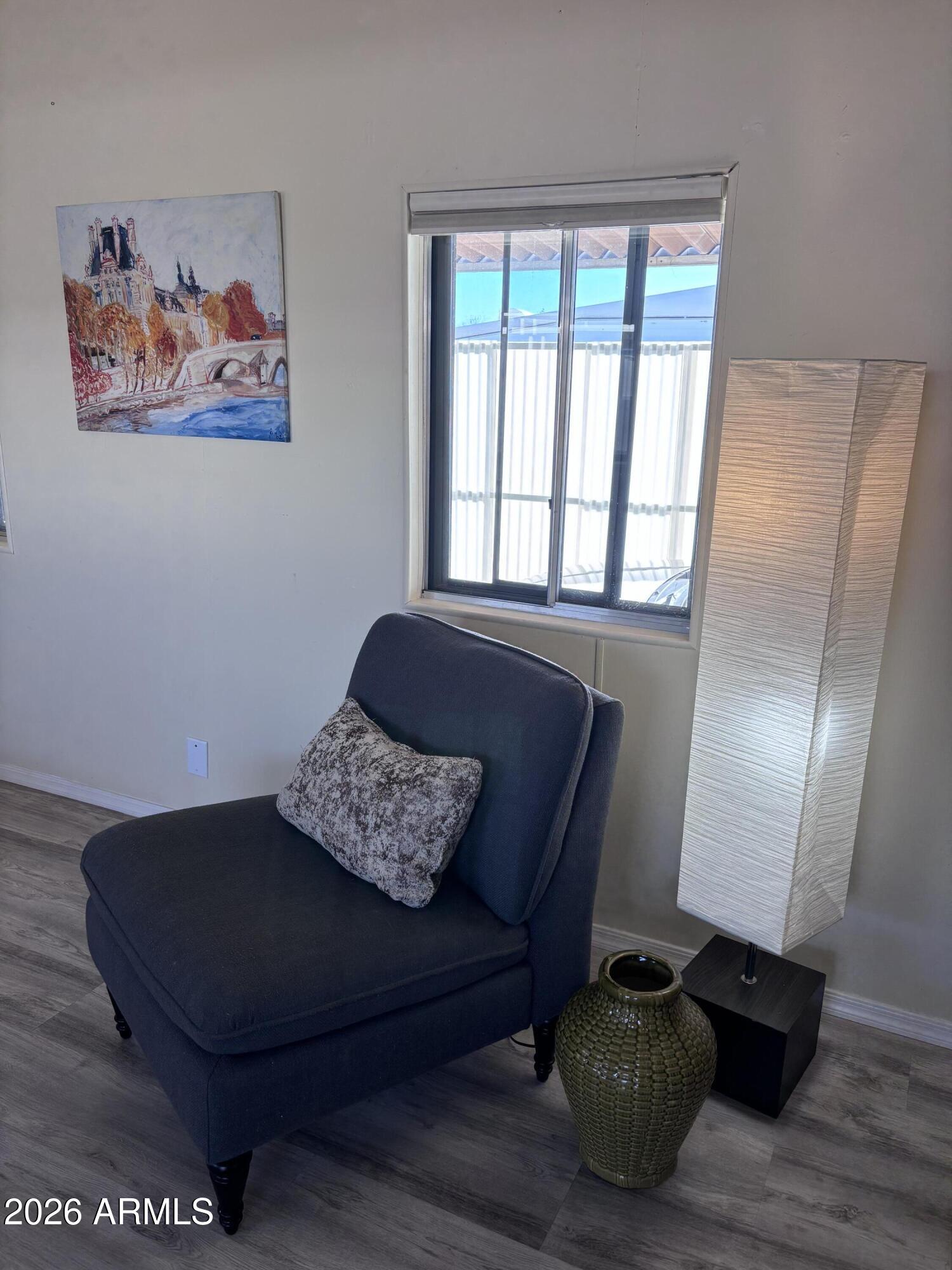 15802 South Gilbert Road, Unit 131 Chandler, AZ 85225 - Photo 7 of 30 a living room with furniture and a potted plant