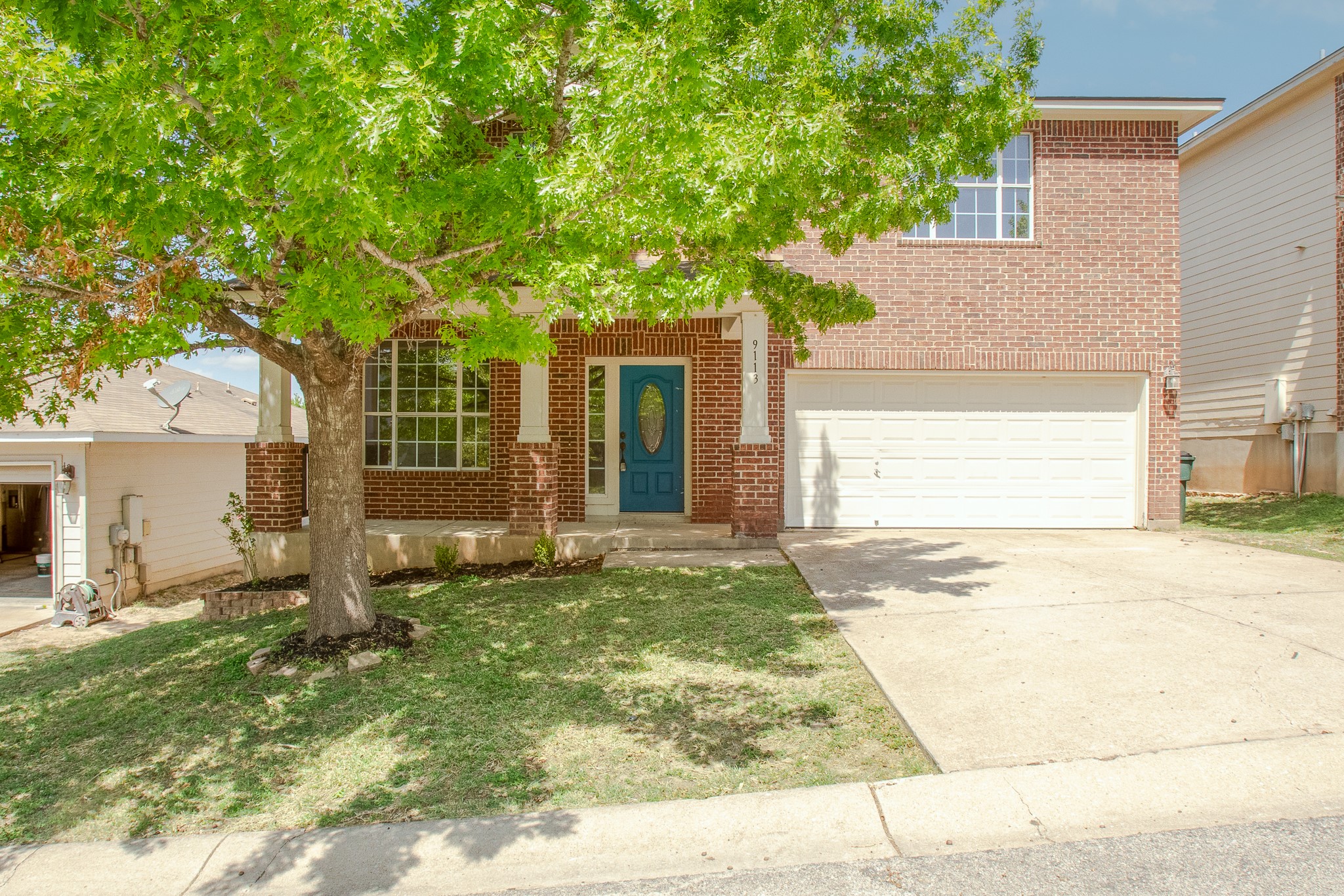 front view of a house with a yard