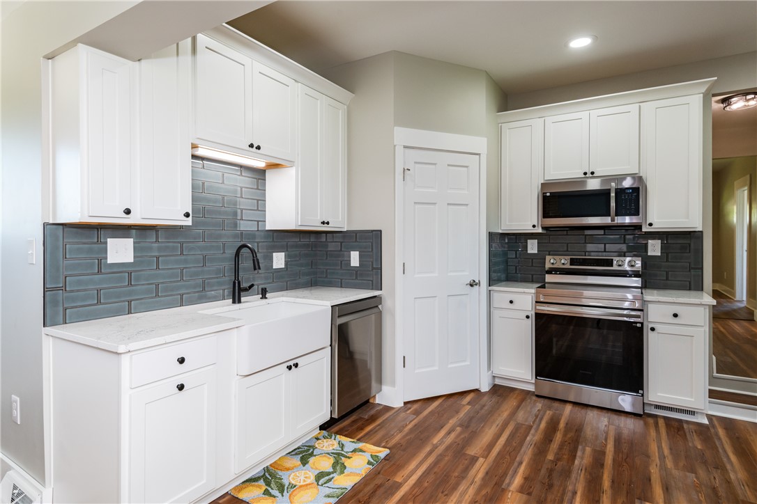 1217 Jasper Road Xenia, OH 45385 - Photo 20 of 62 This newly renovated kitchen features white cabinetry and modern appliances, perfect for everyday living.