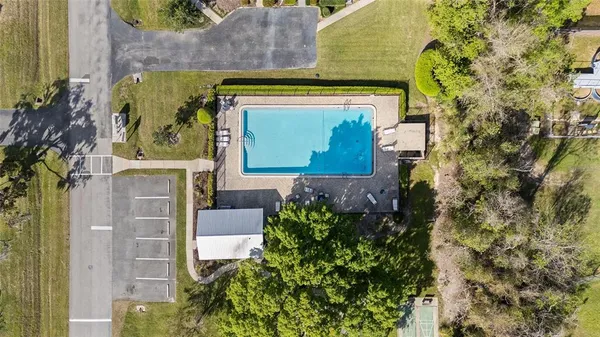 a front view of a house with a garden and patio