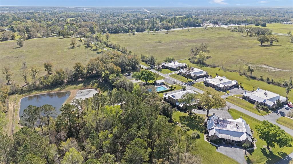 4417 Northwest 74th Terrace Ocala, FL 34482 - Photo 51 of 77 an aerial view of ocean and residential houses with outdoor space