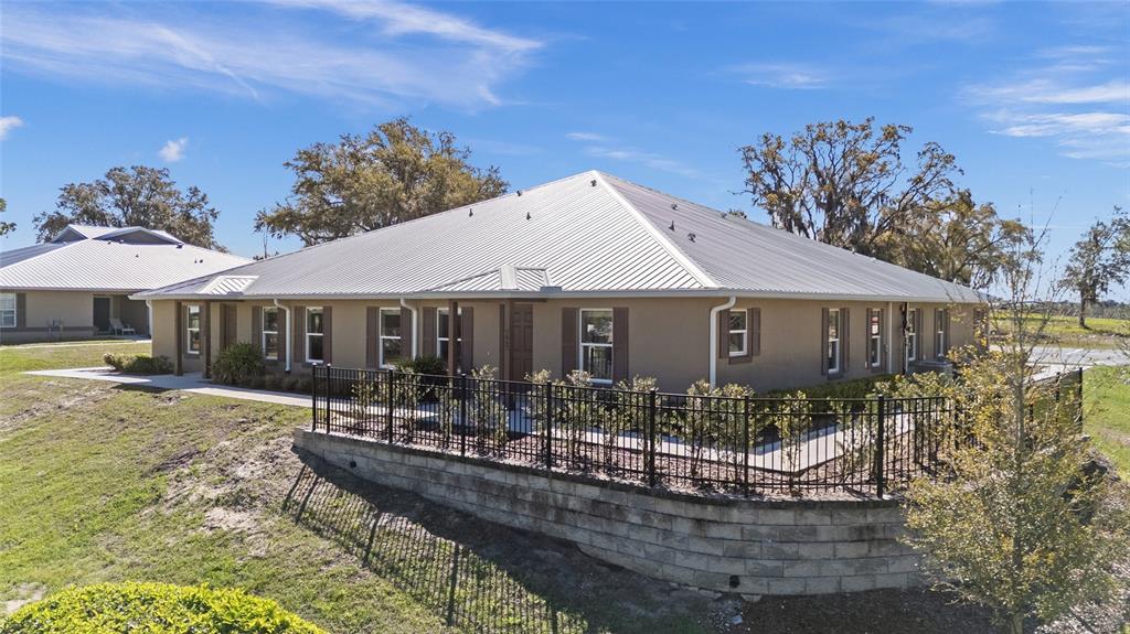 4417 Northwest 74th Terrace Ocala, FL 34482 - Photo 70 of 77 a front view of a house with garden