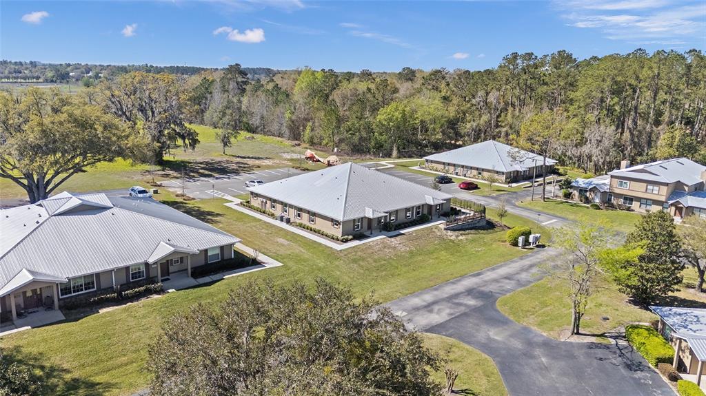 4417 Northwest 74th Terrace Ocala, FL 34482 - Photo 72 of 77 a view of a swimming pool with a yard and mountain view