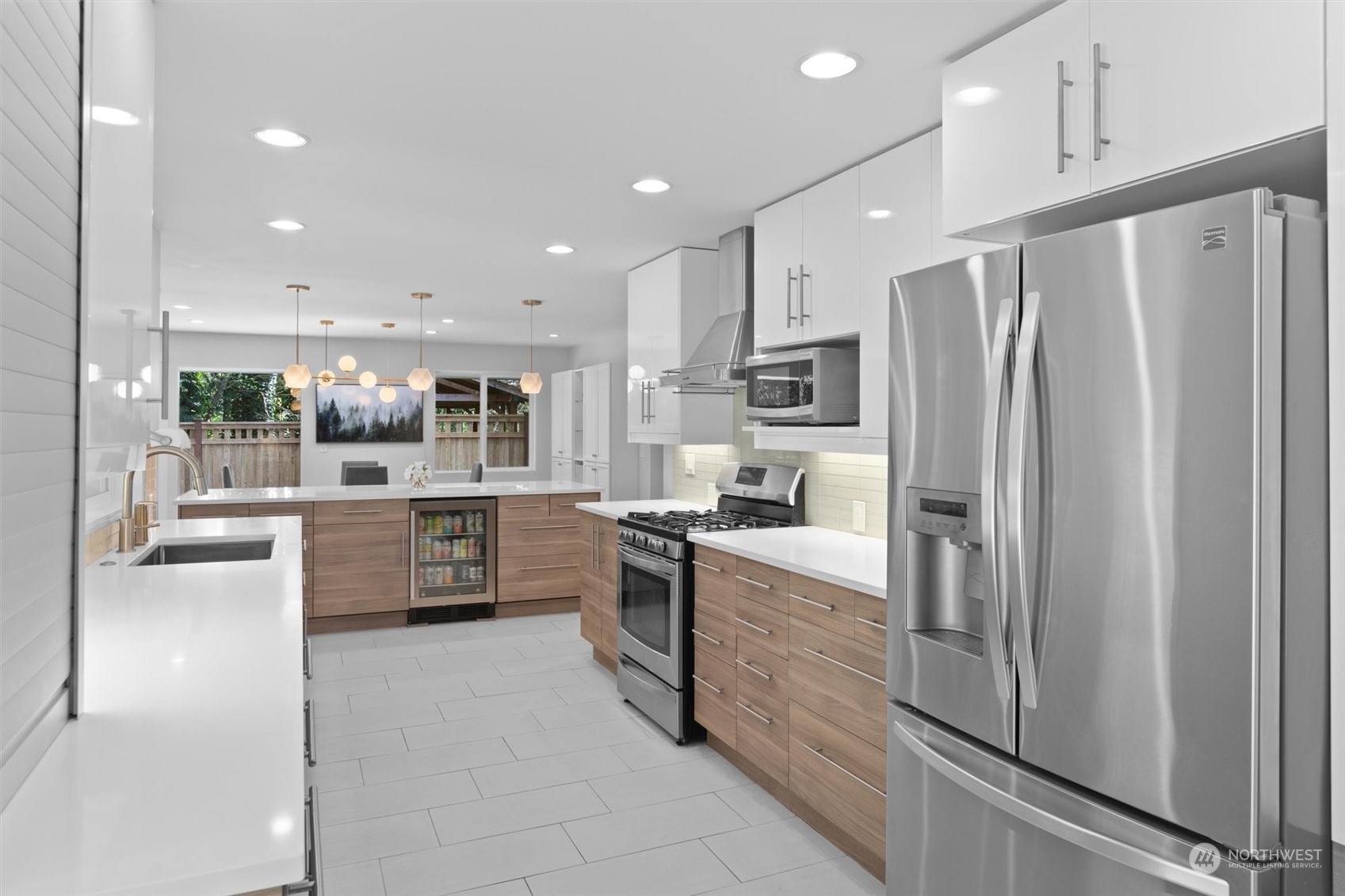 9631 Northeast 198th Street Bothell, WA 98011 - Photo 17 of 40 a kitchen with stainless steel appliances a refrigerator sink and stove