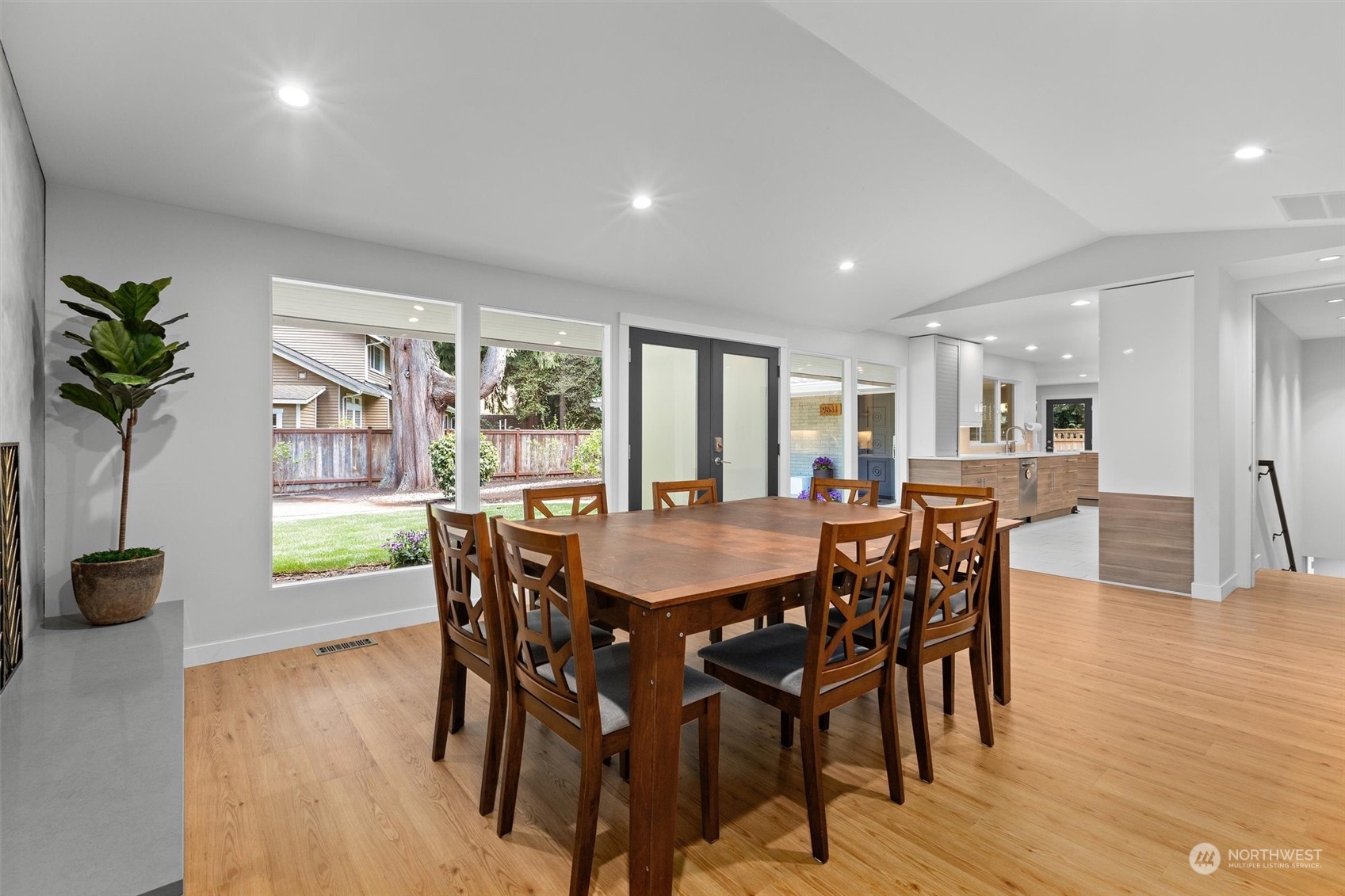 9631 Northeast 198th Street Bothell, WA 98011 - Photo 19 of 40 a view of a dining room with furniture and wooden floor