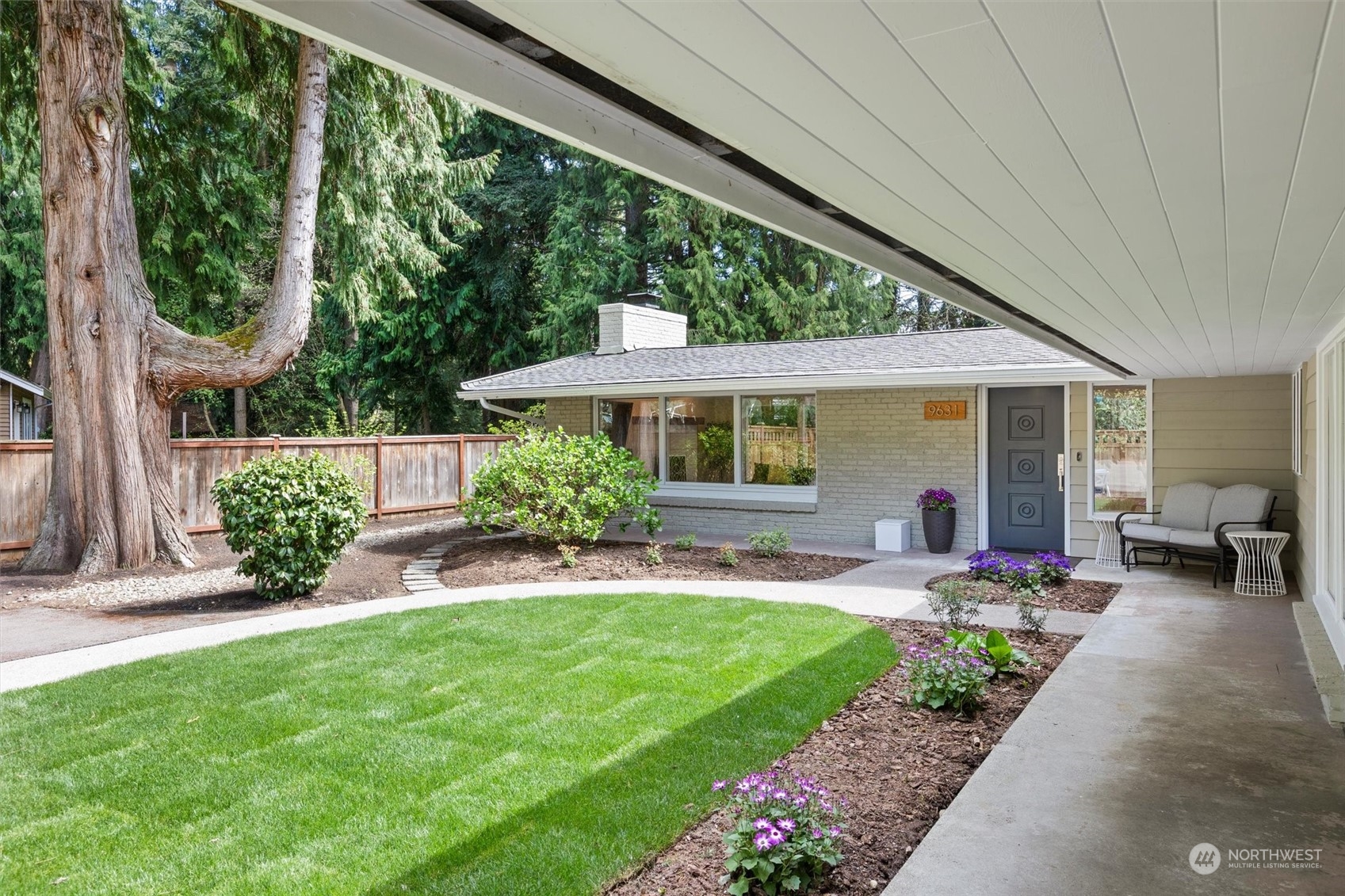 9631 Northeast 198th Street Bothell, WA 98011 - Photo 2 of 40 a front view of a house with garden and porch