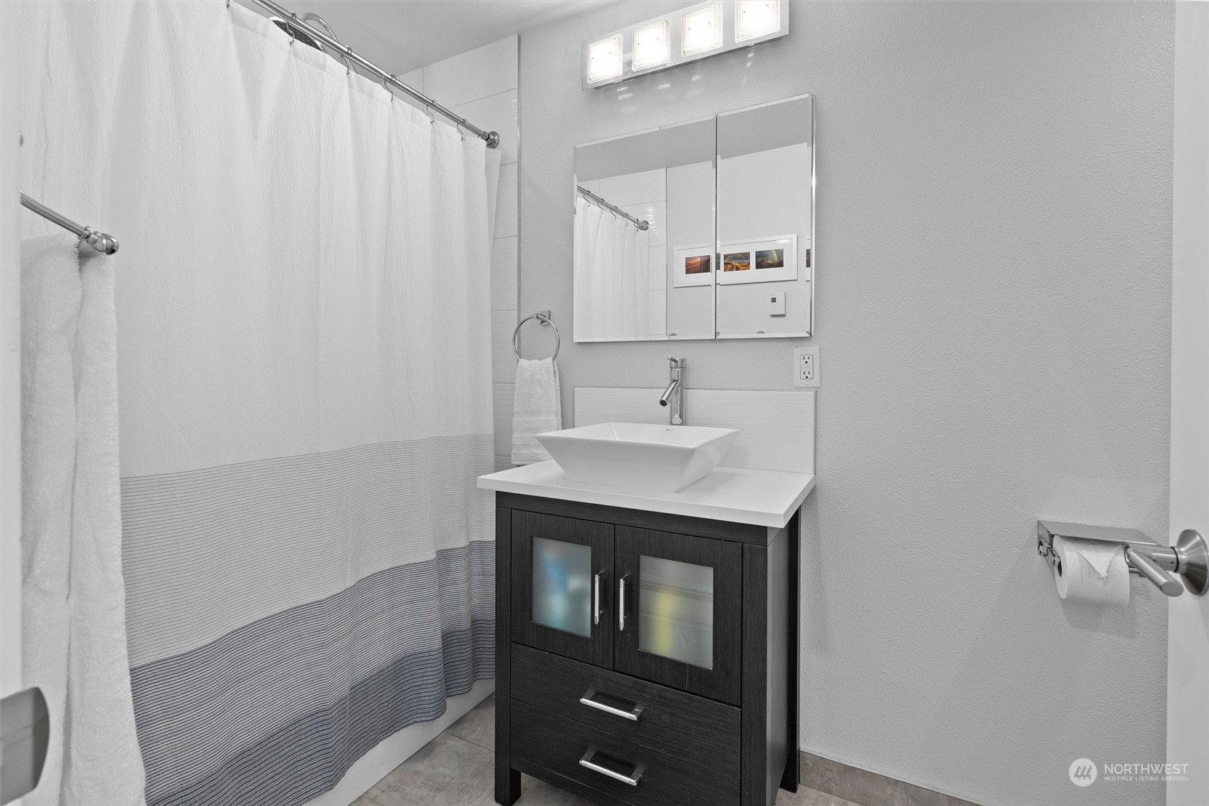 9631 Northeast 198th Street Bothell, WA 98011 - Photo 23 of 40 a bathroom with a sink and a mirror