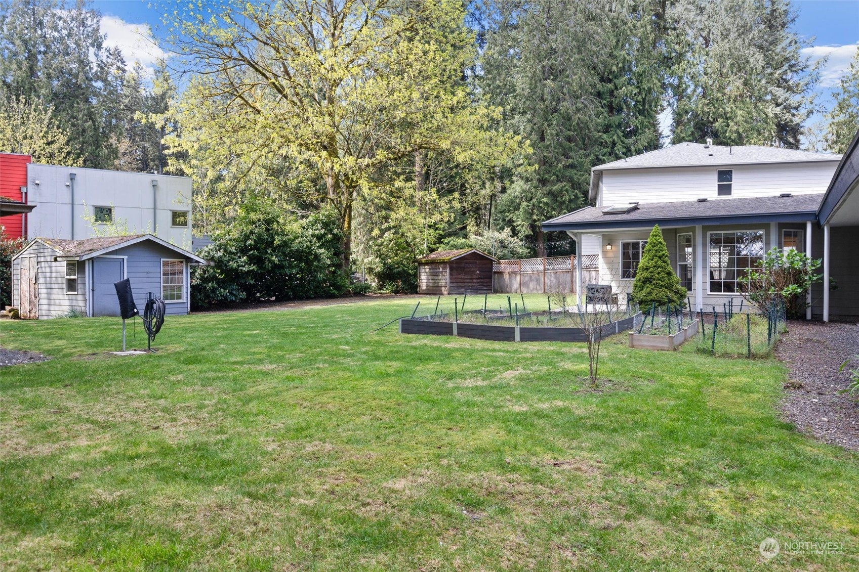 9631 Northeast 198th Street Bothell, WA 98011 - Photo 35 of 40 a view of a house with a backyard and a patio