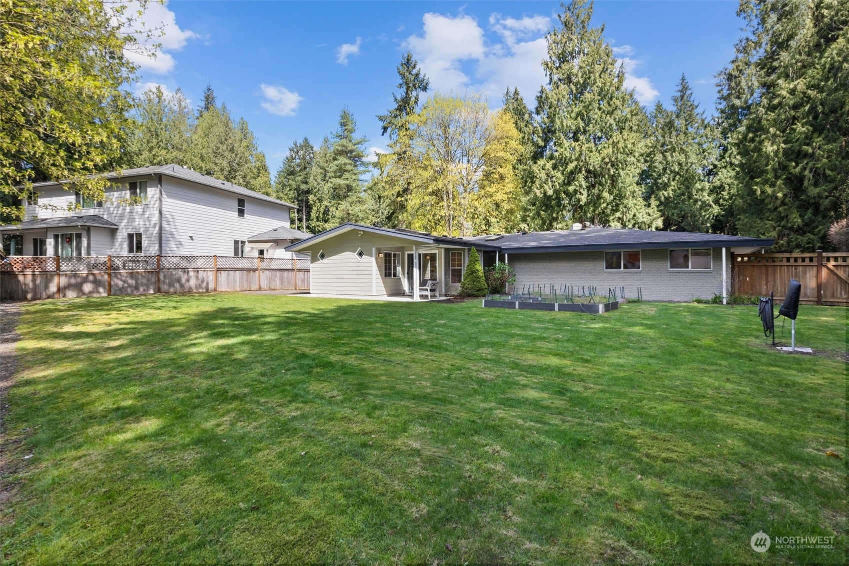 9631 Northeast 198th Street Bothell, WA 98011 - Photo 36 of 40 a view of a house with a yard and sitting area