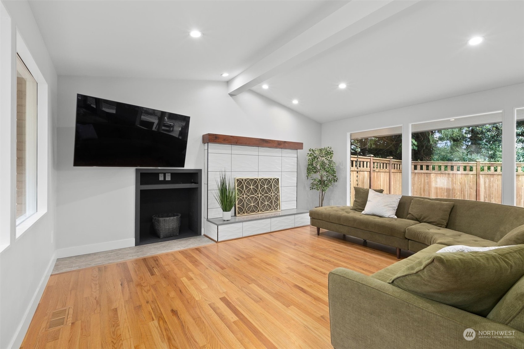 9631 Northeast 198th Street Bothell, WA 98011 - Photo 6 of 40 a living room with furniture and a flat screen tv